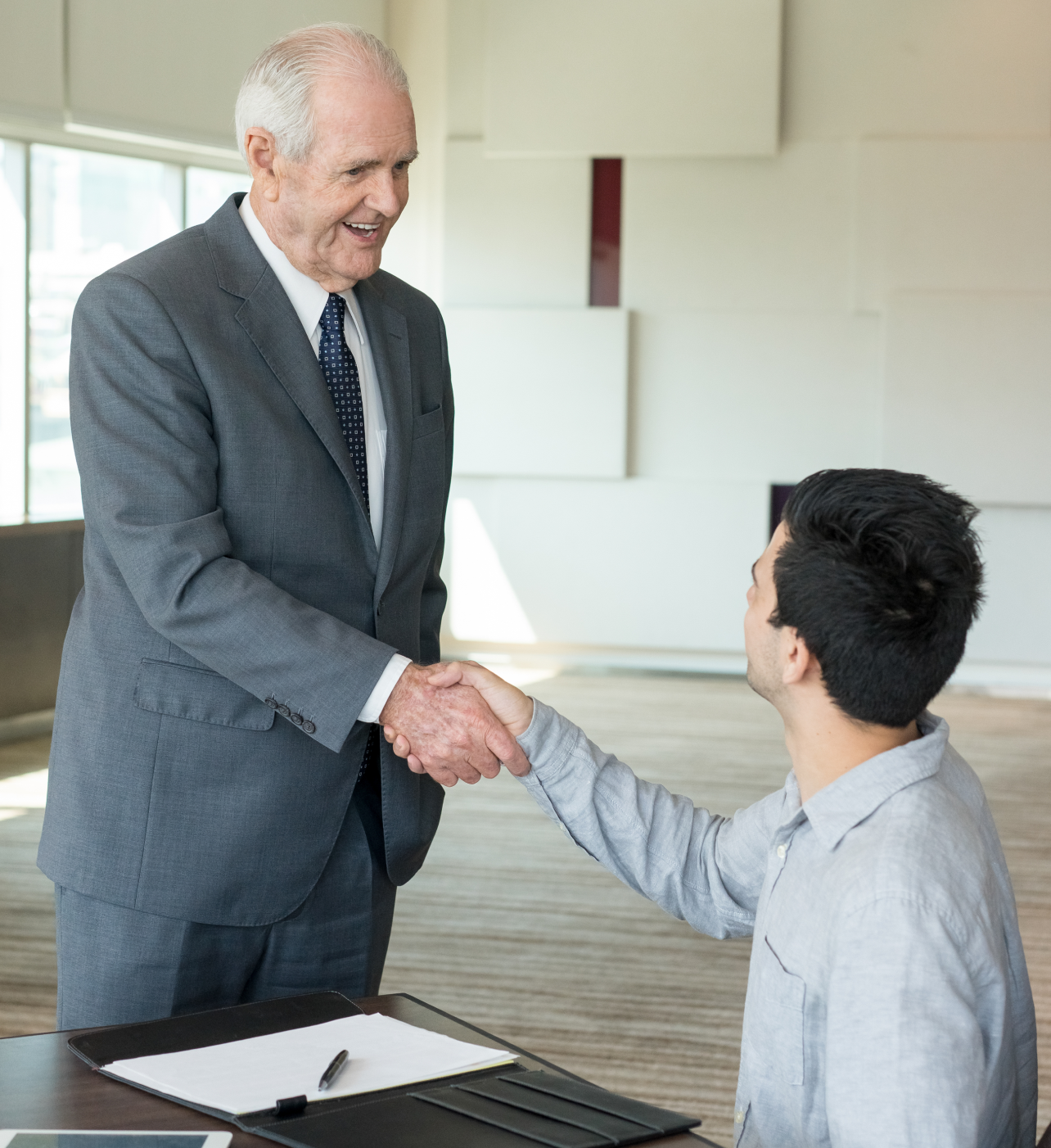 Business partners shaking hands in agreement